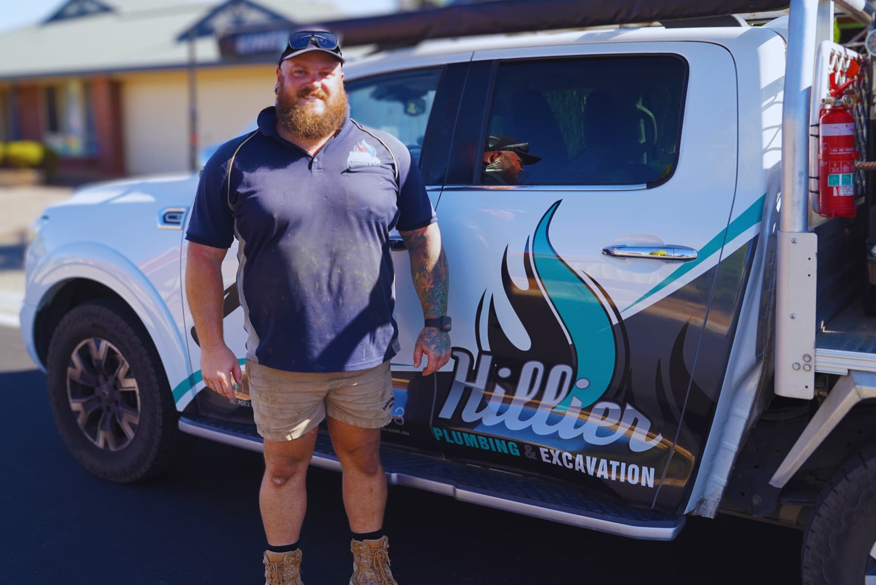 Josh Hillier, owner of Hillier Plumbing & Excavation, beside his service vehicle