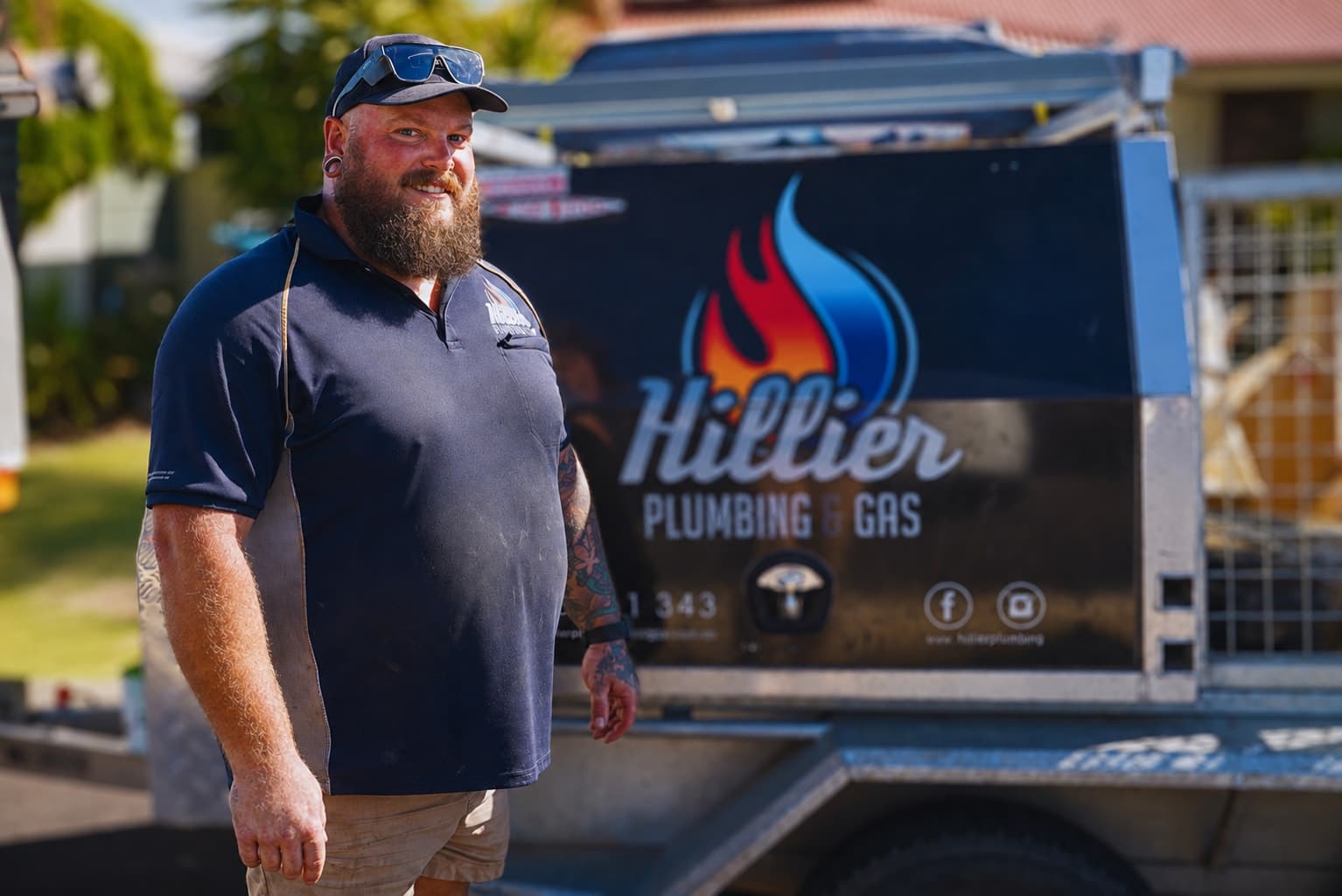 Josh Hillier with branded excavation equipment